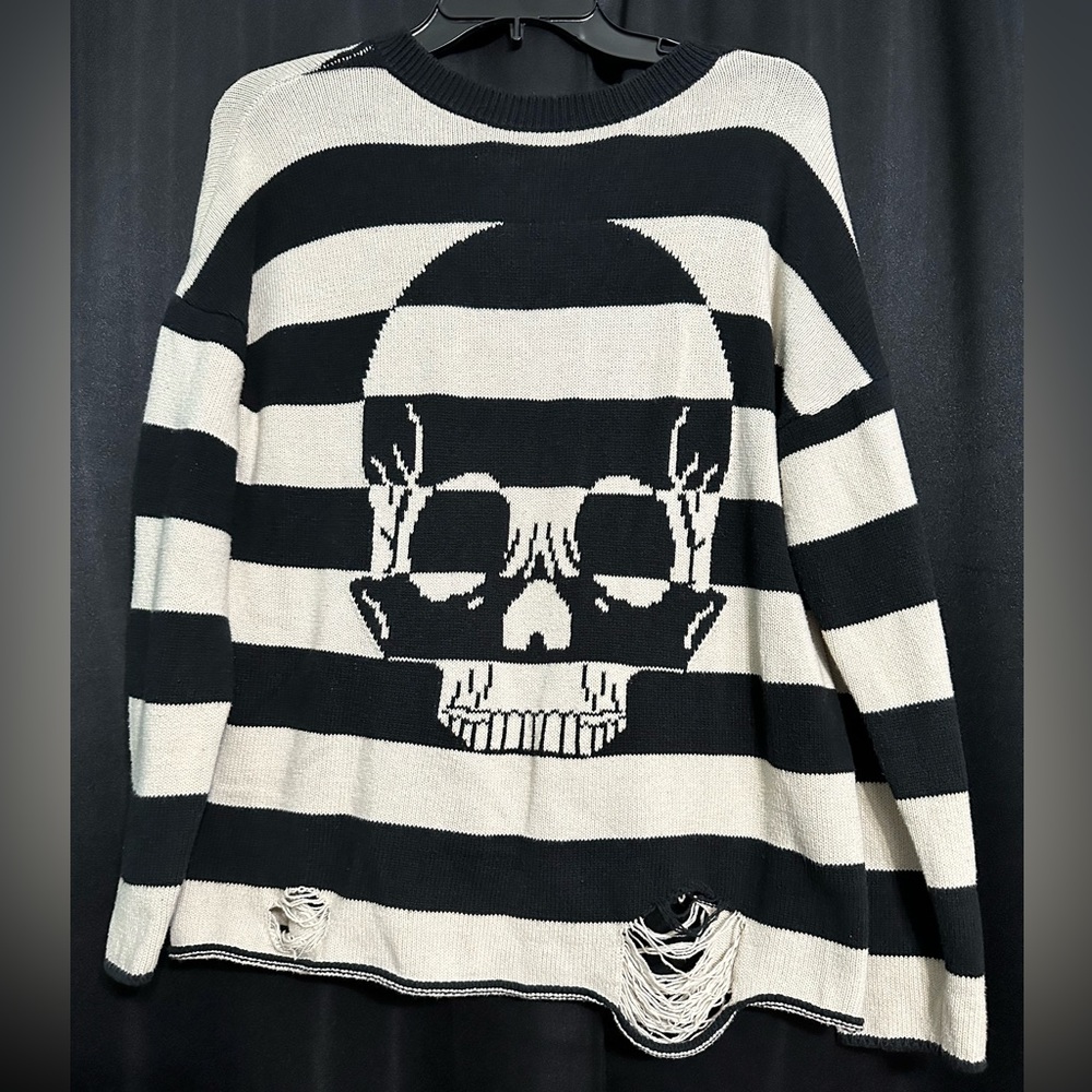 skull ripped sweater